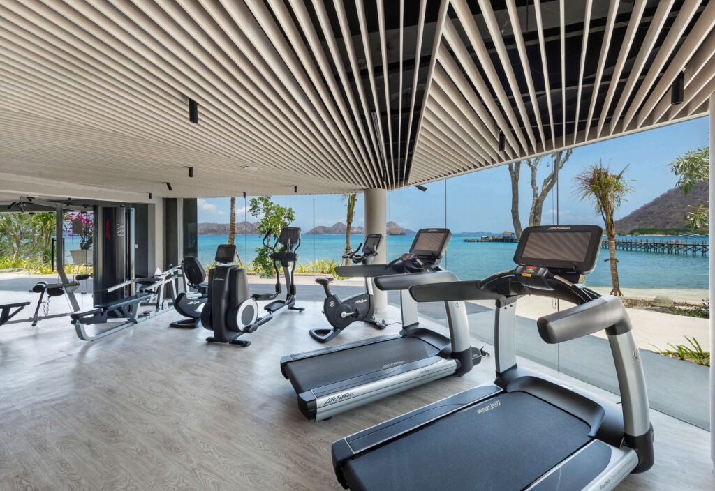 AYANA Komodo Fitness Center with cardio and strength equipment overlooking the sea