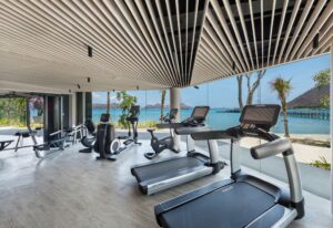 AYANA Komodo Fitness Center with cardio and strength equipment overlooking the sea