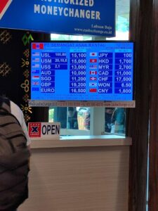 Cash X Change authorized money changer rate board in Labuan Bajo
