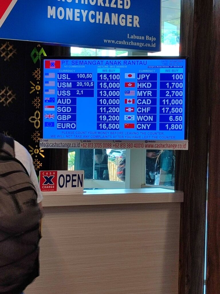 Cash X Change authorized money changer rate board in Labuan Bajo