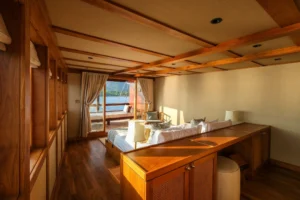 Bed, dressing counter and balcony door in the Celestia Owner’s Suite