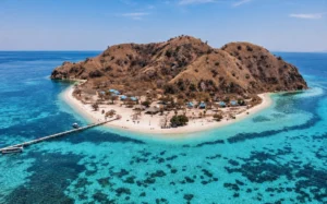 Aerial view of Kanawa Island and its turquoise reef near Labuan Bajo