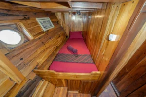 Single bed view inside a twin cabin aboard Kira Kira