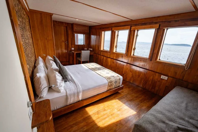 Double cabin with king bed and private balcony aboard Komodo Sea Dragon