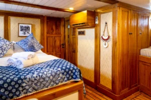 Wooden family cabin interior aboard La Unua