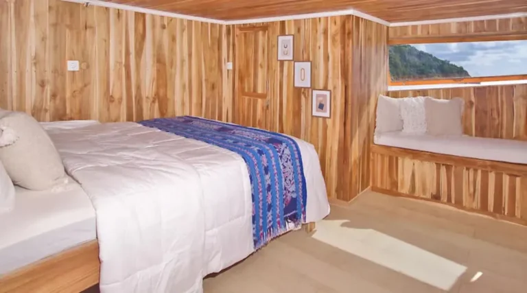Wide view of the Deluxe Ocean View cabin aboard Malca Voyages
