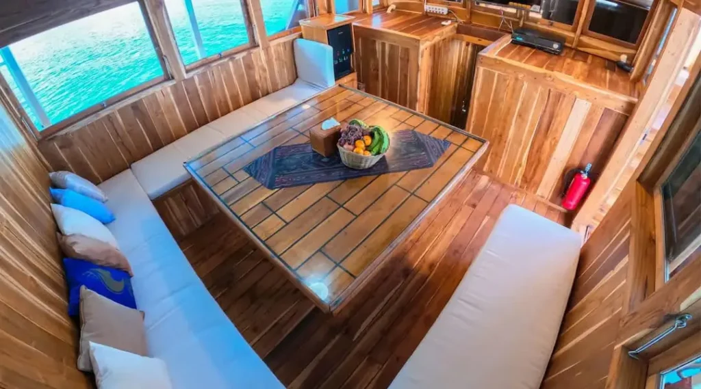Indoor dining area aboard Malca Voyages