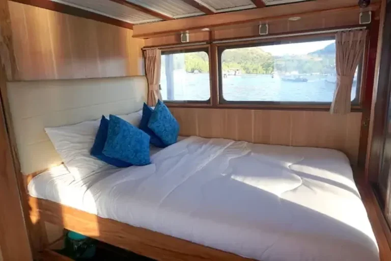 Main-deck double cabin with large windows aboard MV NusaTara