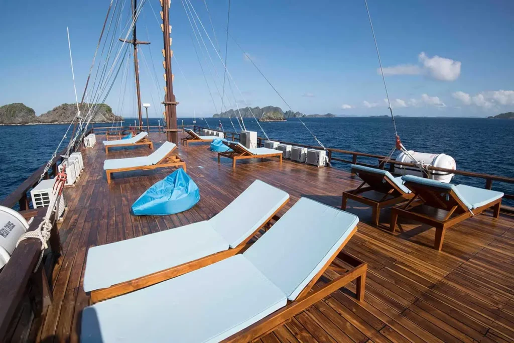 White sun loungers on the Neomi Cruise sun deck overlooking the sea
