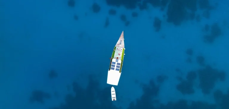 Aerial top view of Sokaraja liveaboard over blue Komodo waters