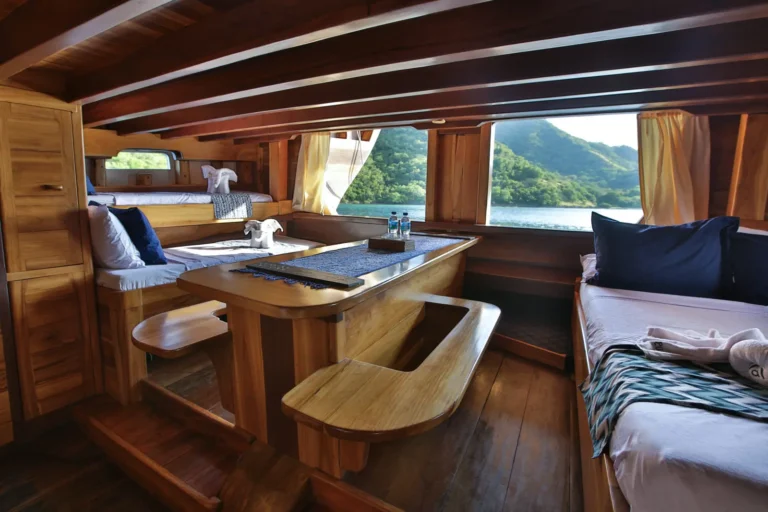 Family cabin with multiple beds aboard Tanaka Phinisi