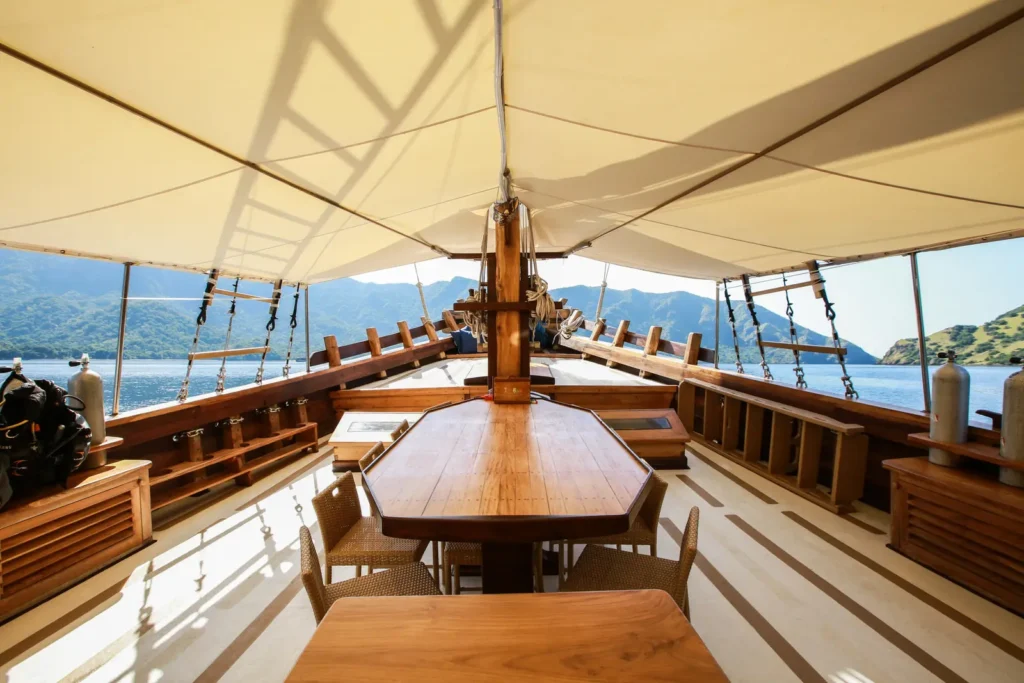 Open sun deck and table aboard Tanaka Phinisi