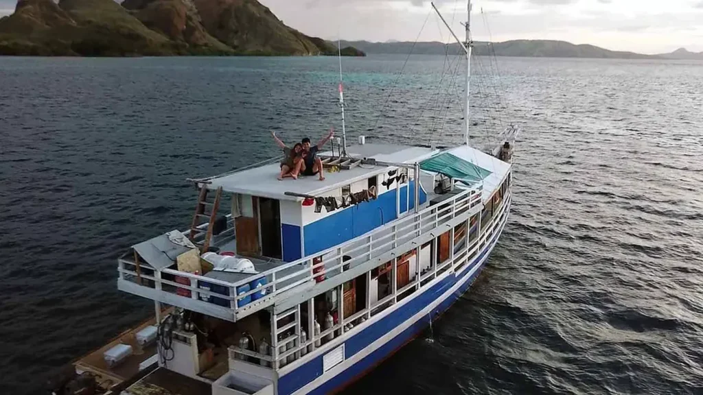 Aerial view of the stern and upper deck of Tatawa liveaboard on calm water